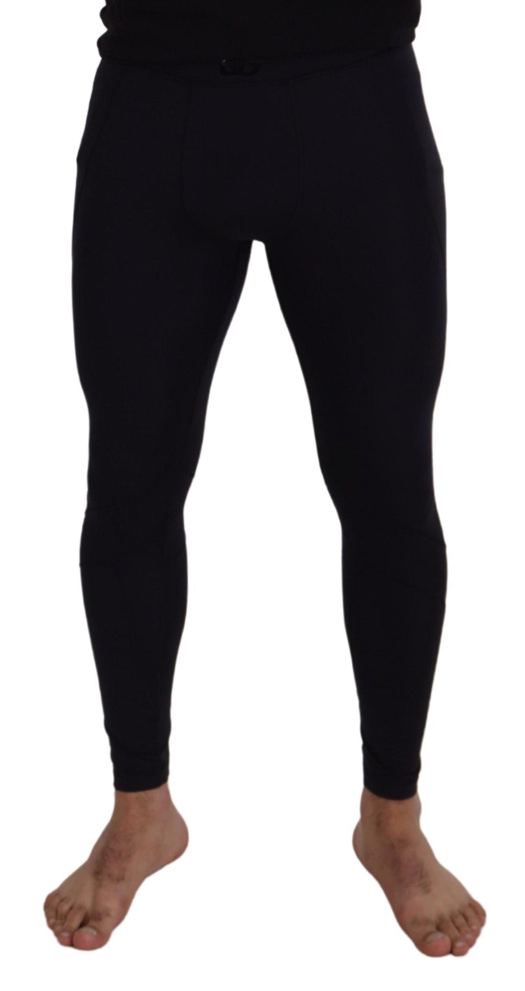 Black nylon slim fit stretch pants by Dolce & Gabbana, showing a close-up of the sleek, fitted design and smooth fabric texture.