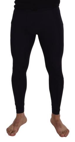 Black nylon slim fit stretch pants by Dolce & Gabbana, showing a close-up of the sleek, fitted design and smooth fabric texture.
