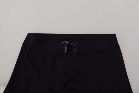 Black nylon slim fit stretch pants by Dolce & Gabbana, showing the sleek, fitted design and smooth fabric texture.