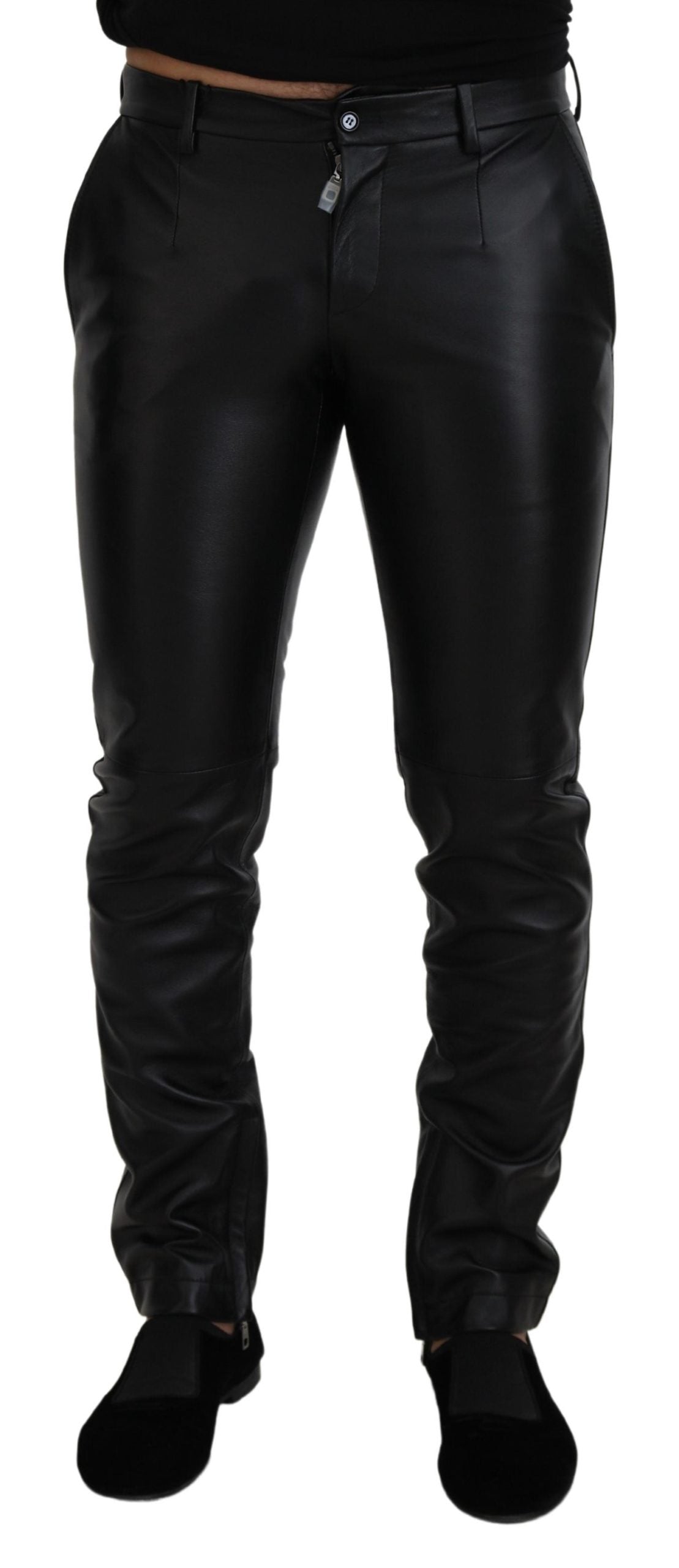 Black shiny stretch skinny pants by Dolce & Gabbana, close-up of sleek, fitted design and smooth fabric texture.