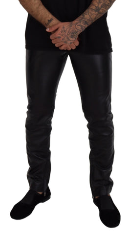 Black shiny stretch skinny pants by Dolce & Gabbana, fitted and sleek with a glossy finish, suitable for stylish casual or evening wear.
