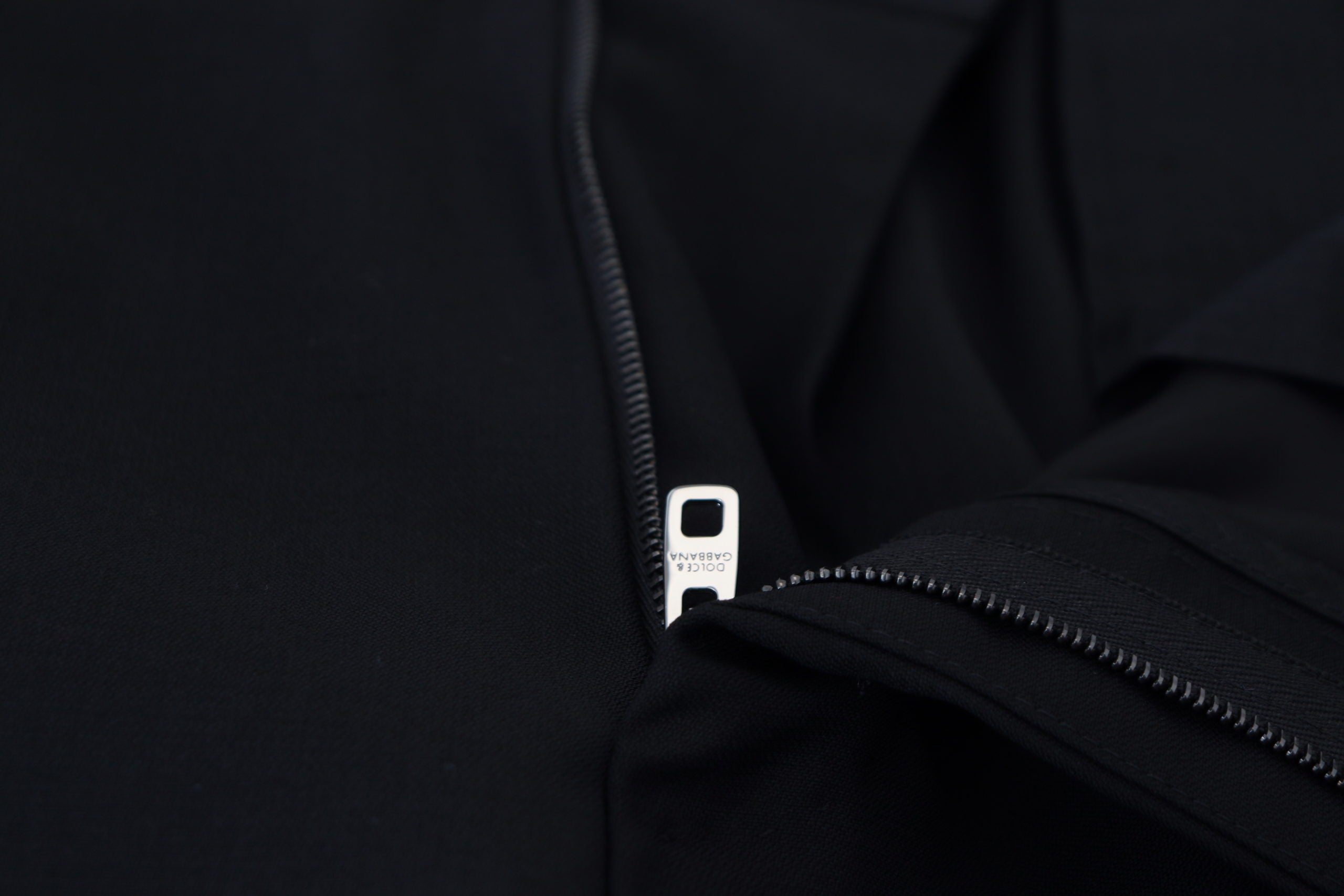 Black wool chino formal pants by Dolce & Gabbana, tailored fit with classic design and clean front pockets.