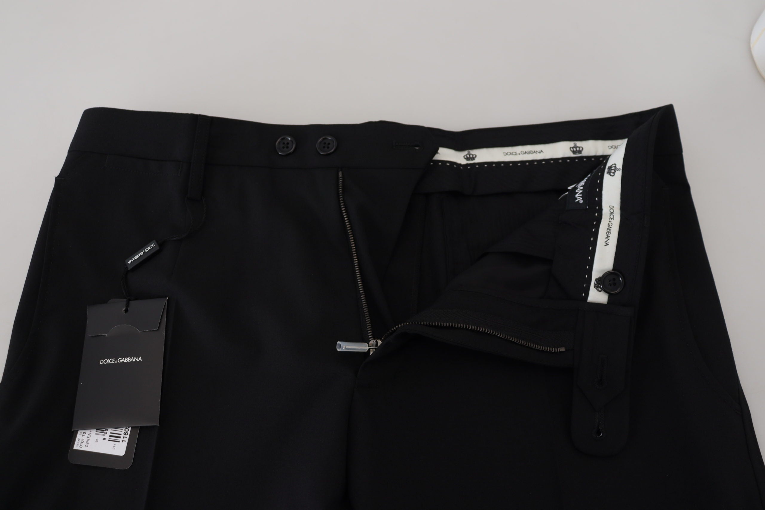 Black polyester chino formal pants by Dolce & Gabbana, tailored fit with clean design and classic waistline.