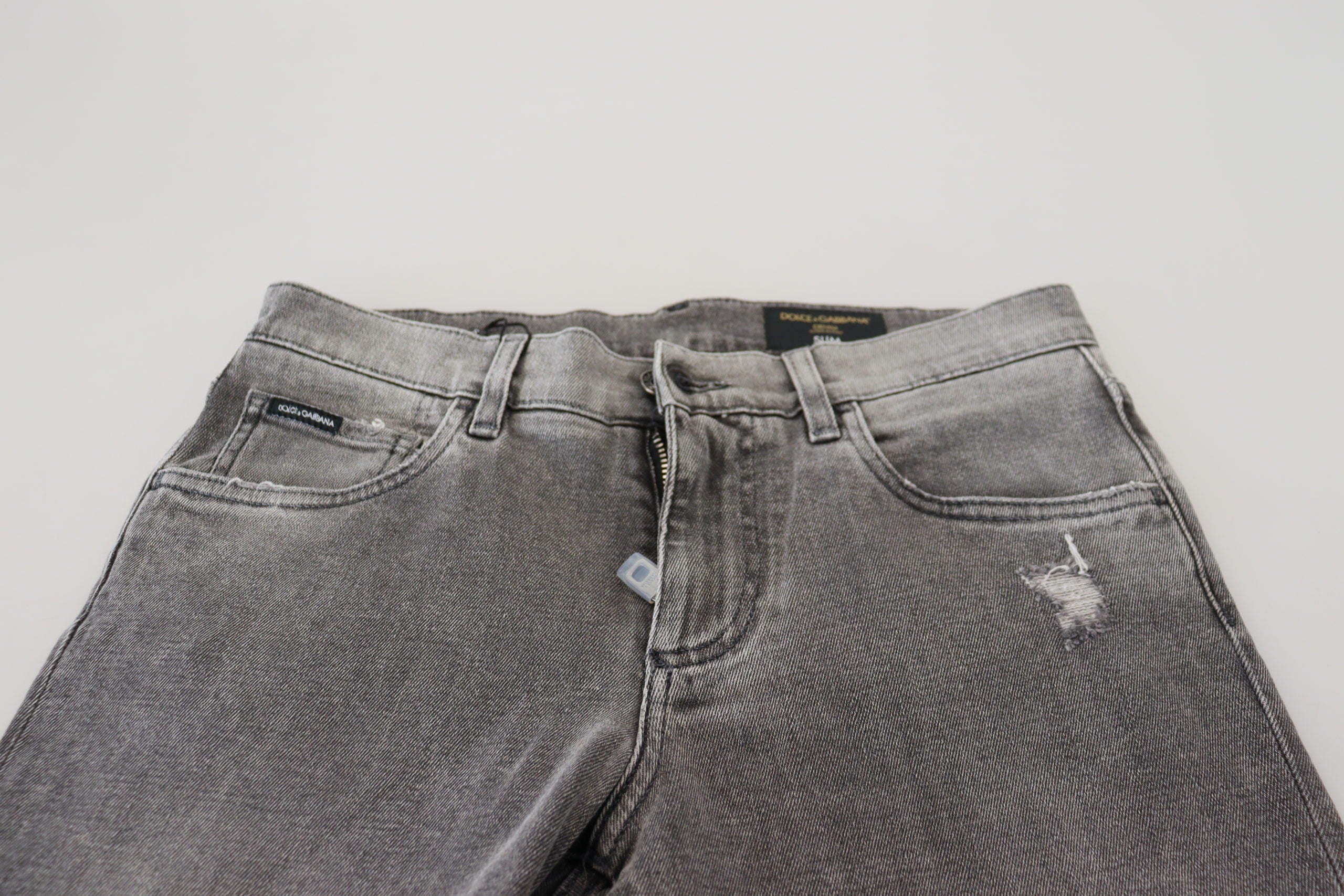 Grey washed cotton skinny denim jeans from Dolce & Gabbana, featuring a fitted design and classic five-pocket styling.
