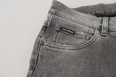 Grey washed cotton skinny denim jeans by Dolce & Gabbana, shown with a close-up of the fitted style and distressed details.