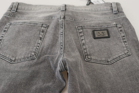 Gray washed cotton skinny denim jeans by Dolce & Gabbana, showing a close-up of the fitted jeans with faded detailing.