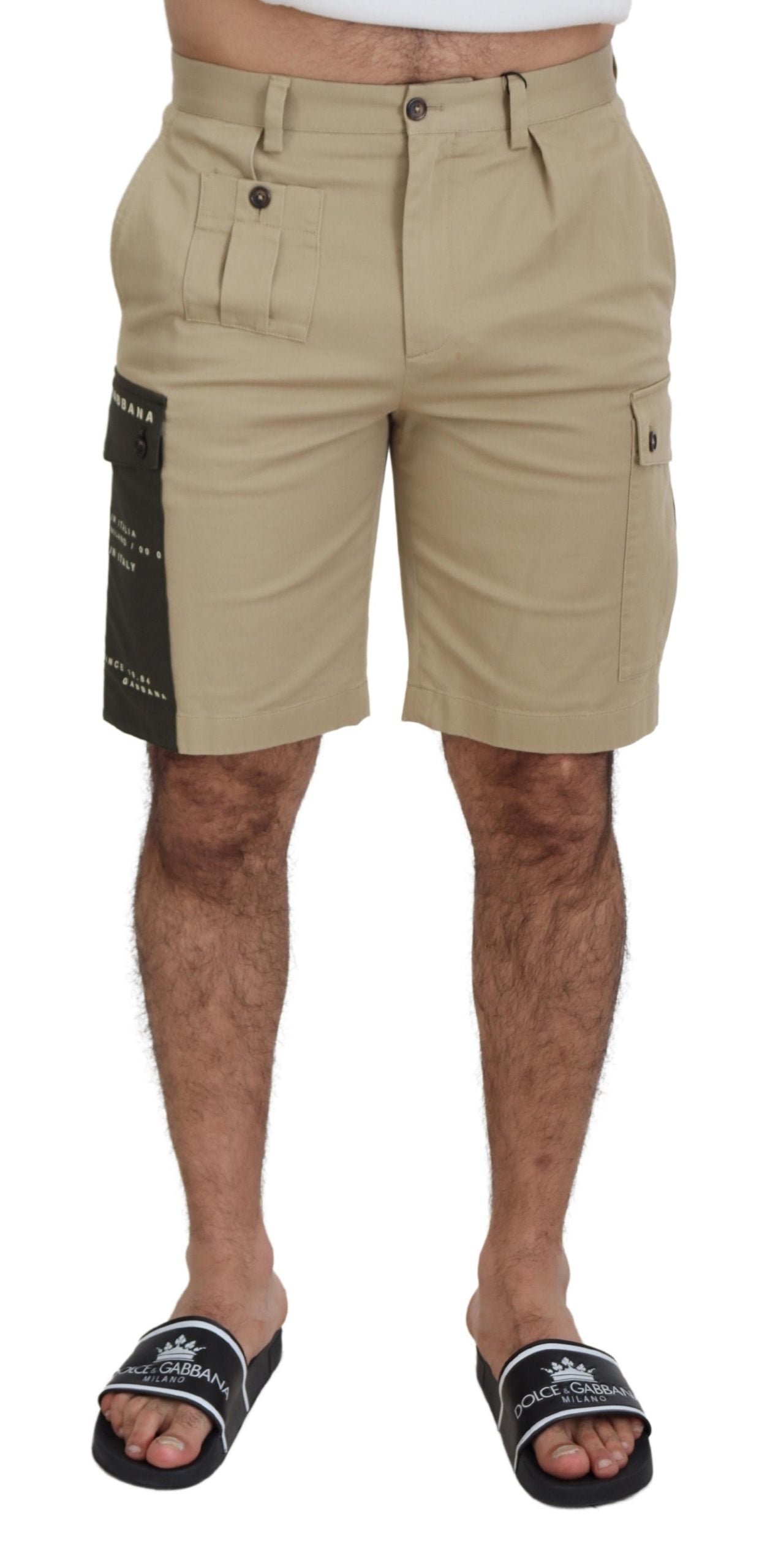 Beige cotton cargo Bermuda shorts by Dolce & Gabbana with multiple pockets and relaxed fit, shown on a model.