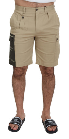 Beige cotton cargo Bermuda shorts by Dolce & Gabbana with multiple pockets and a relaxed fit, displayed on a neutral background.