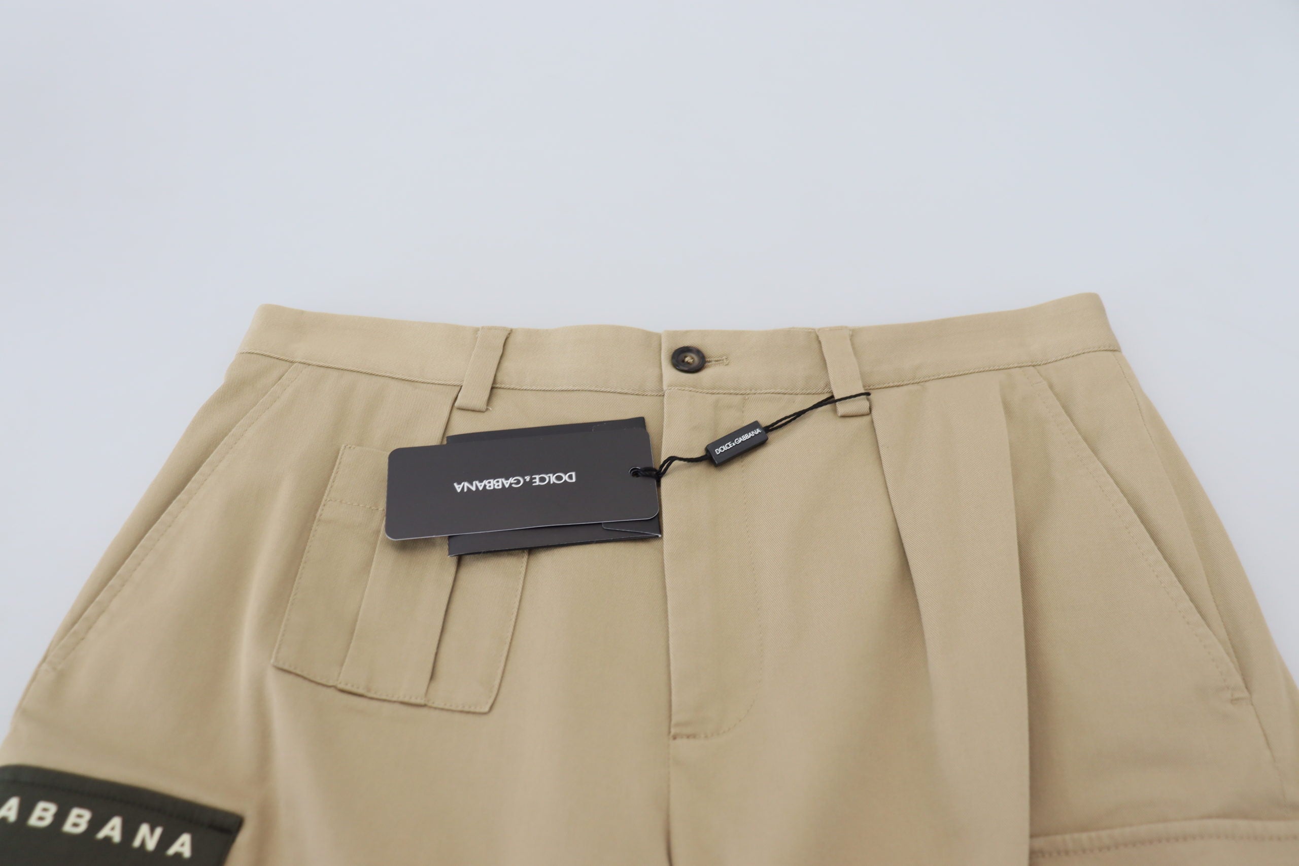 Beige cotton cargo Bermuda shorts by Dolce & Gabbana, featuring multiple pockets and a relaxed fit, perfect for casual summer wear.