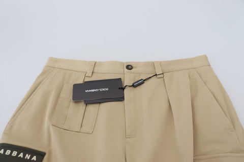 Beige cotton cargo Bermuda shorts by Dolce & Gabbana, featuring multiple pockets and a relaxed fit, perfect for casual summer wear.