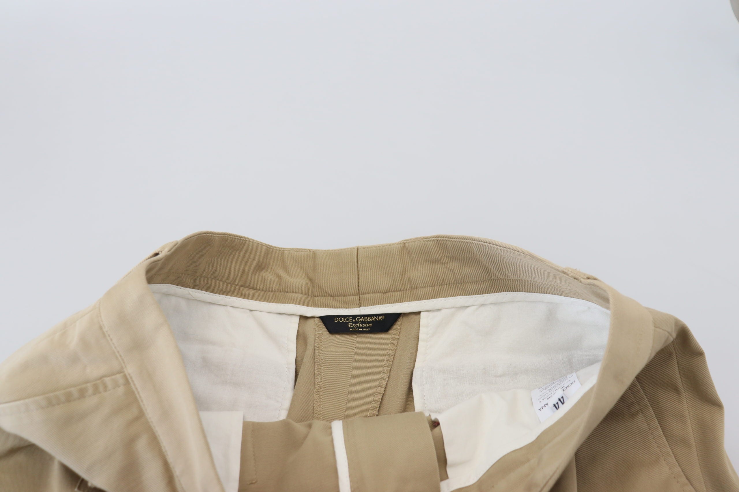 Beige cotton cargo Bermuda shorts by Dolce & Gabbana, featuring multiple pockets and a relaxed fit, displayed on a neutral background.
