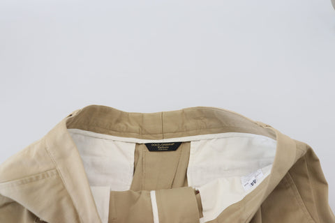 Beige cotton cargo Bermuda shorts by Dolce & Gabbana, featuring multiple pockets and a relaxed fit, displayed on a neutral background.