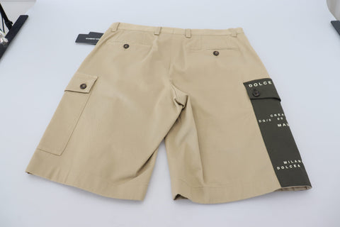 Beige cotton cargo Bermuda shorts by Dolce & Gabbana, with multiple pockets and a relaxed fit, displayed on a neutral background.