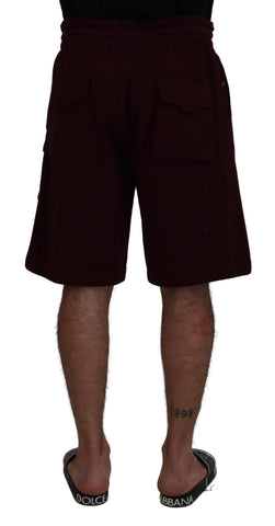 Maroon Bermuda cargo shorts for men by Dolce & Gabbana, featuring multiple pockets and a relaxed fit.