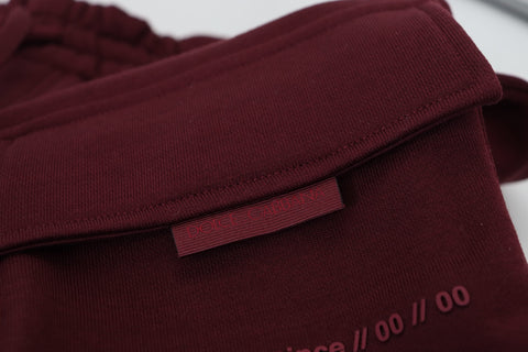 Maroon Dolce & Gabbana men's Bermuda cargo shorts with multiple pockets and relaxed fit, displayed on a neutral background.