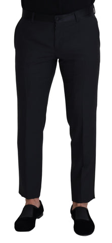 Black wool men's formal pants by Dolce & Gabbana, tailored fit with classic design and belt loops, shown on a hanger.
