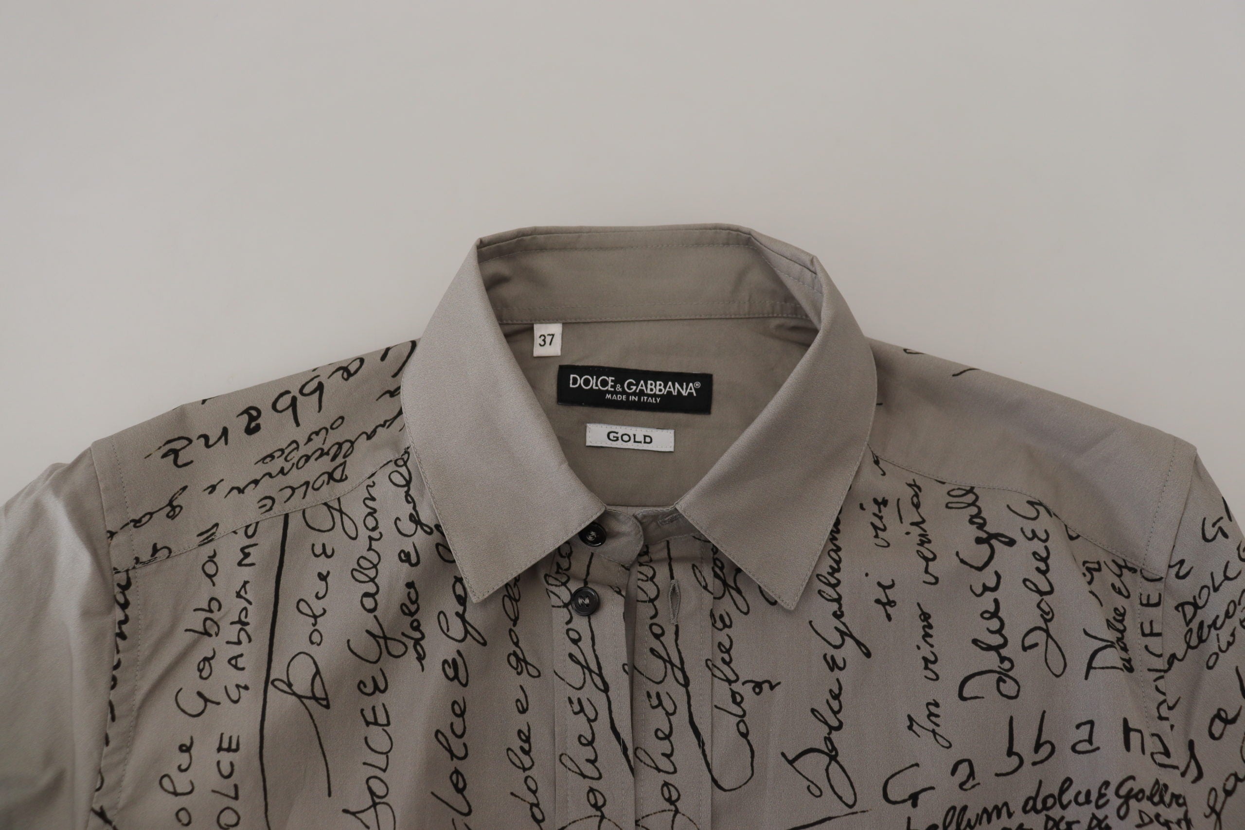 Gray printed cotton slim dress by Dolce & Gabbana featuring a gold shirt-style design and tailored fit.