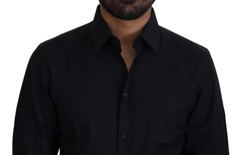 Black cotton slim fit formal dress shirt by Dolce & Gabbana with gold accents, displayed on a hanger.