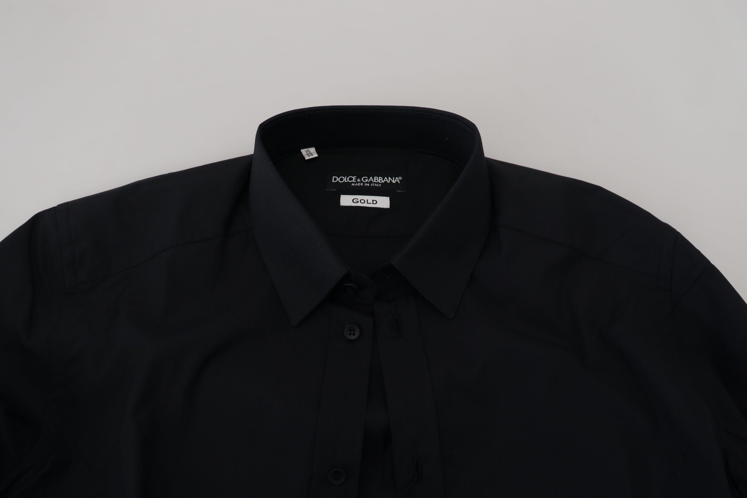Black cotton slim fit formal dress shirt by Dolce & Gabbana featuring a gold accent detail.