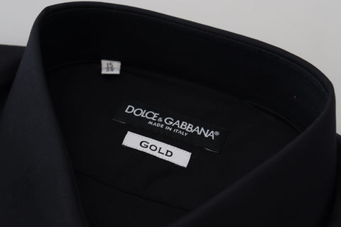 Black cotton slim fit formal dress shirt by Dolce & Gabbana with gold accents, shown on a hanger.