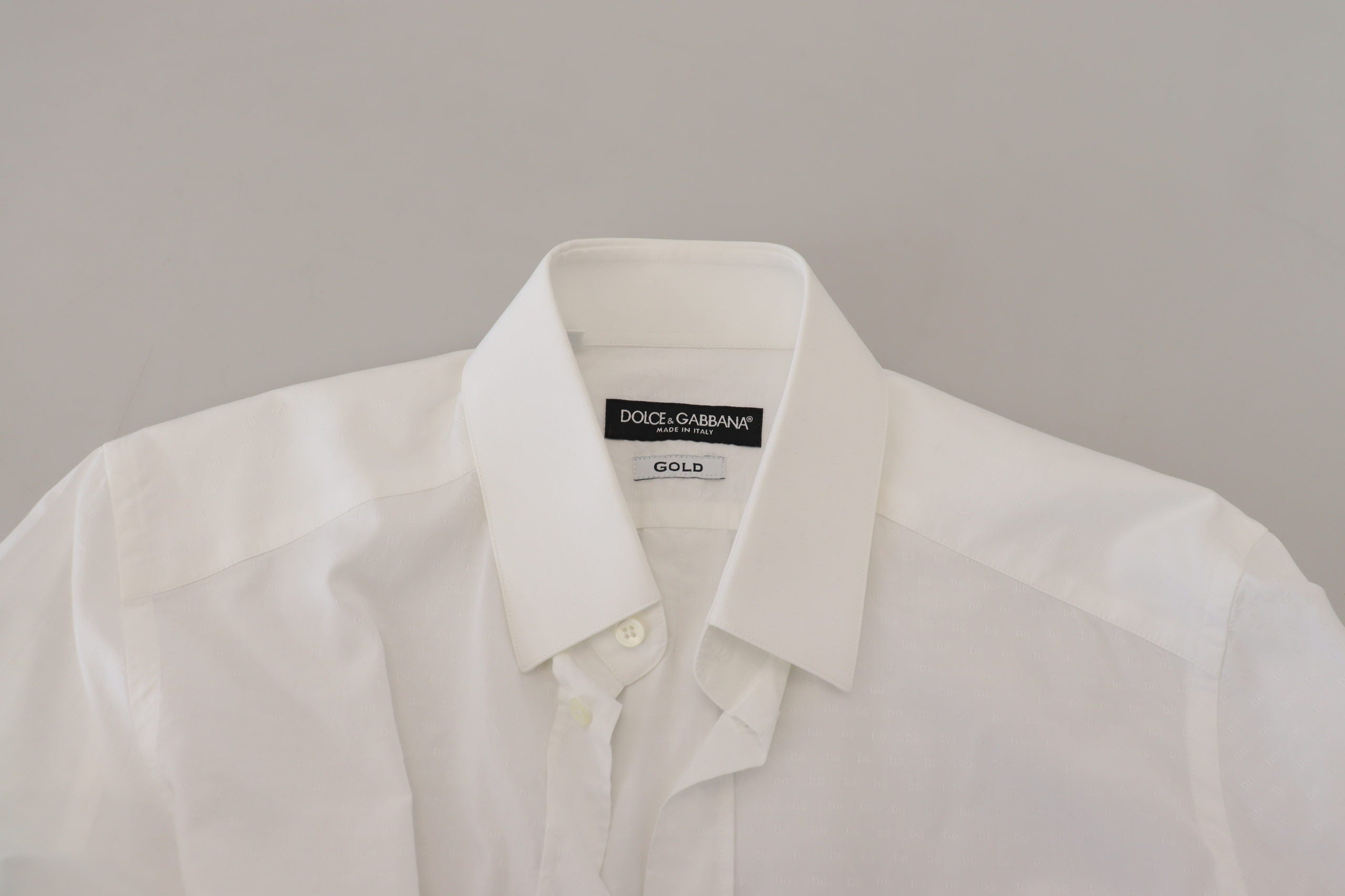White cotton slim fit formal dress shirt by Dolce & Gabbana, featuring a classic gold detail and tailored fit.