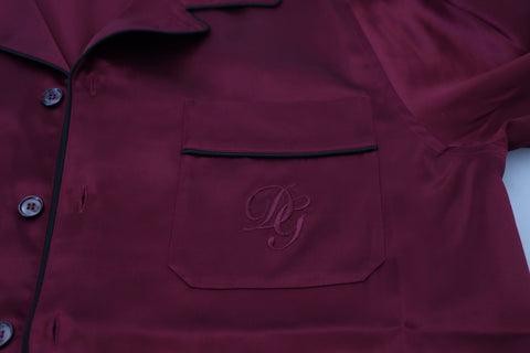 Red silk lounge top pajama sleepwear shirt by Dolce & Gabbana, featuring a smooth, luxurious fabric and relaxed fit.