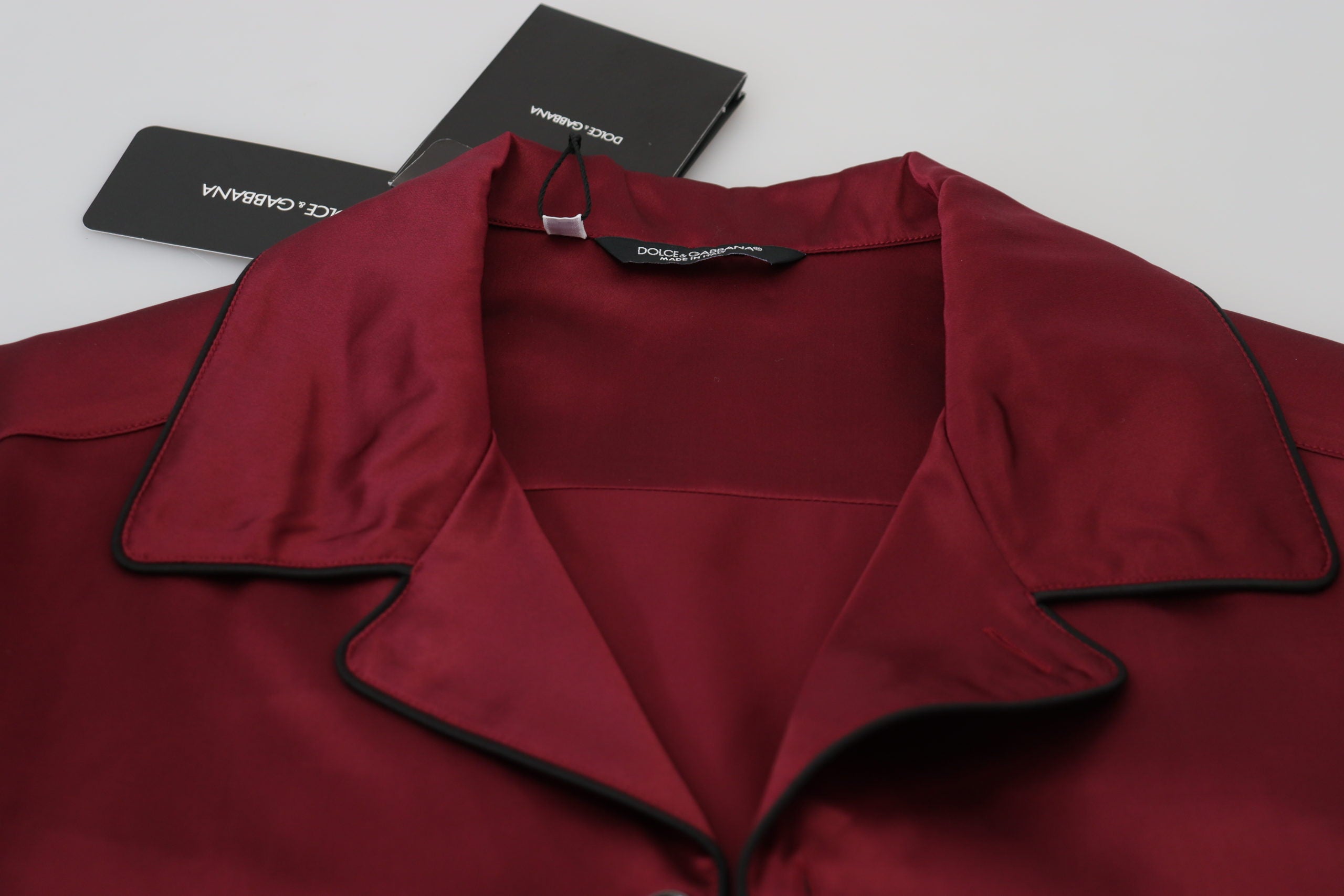 Red silk lounge top pajama sleepwear shirt by Dolce & Gabbana, featuring a smooth, shiny fabric and relaxed fit.