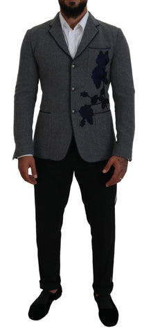 Gray wool blazer with rose embroidery, slim fit jacket by Dolce & Gabbana, shown on a hanger against a neutral background.