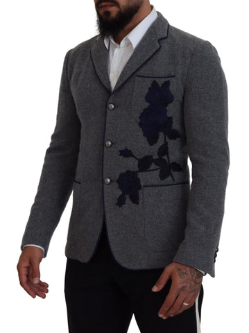 Gray wool blazer with rose embroidery, slim fit Dolce & Gabbana jacket shown on a hanger.