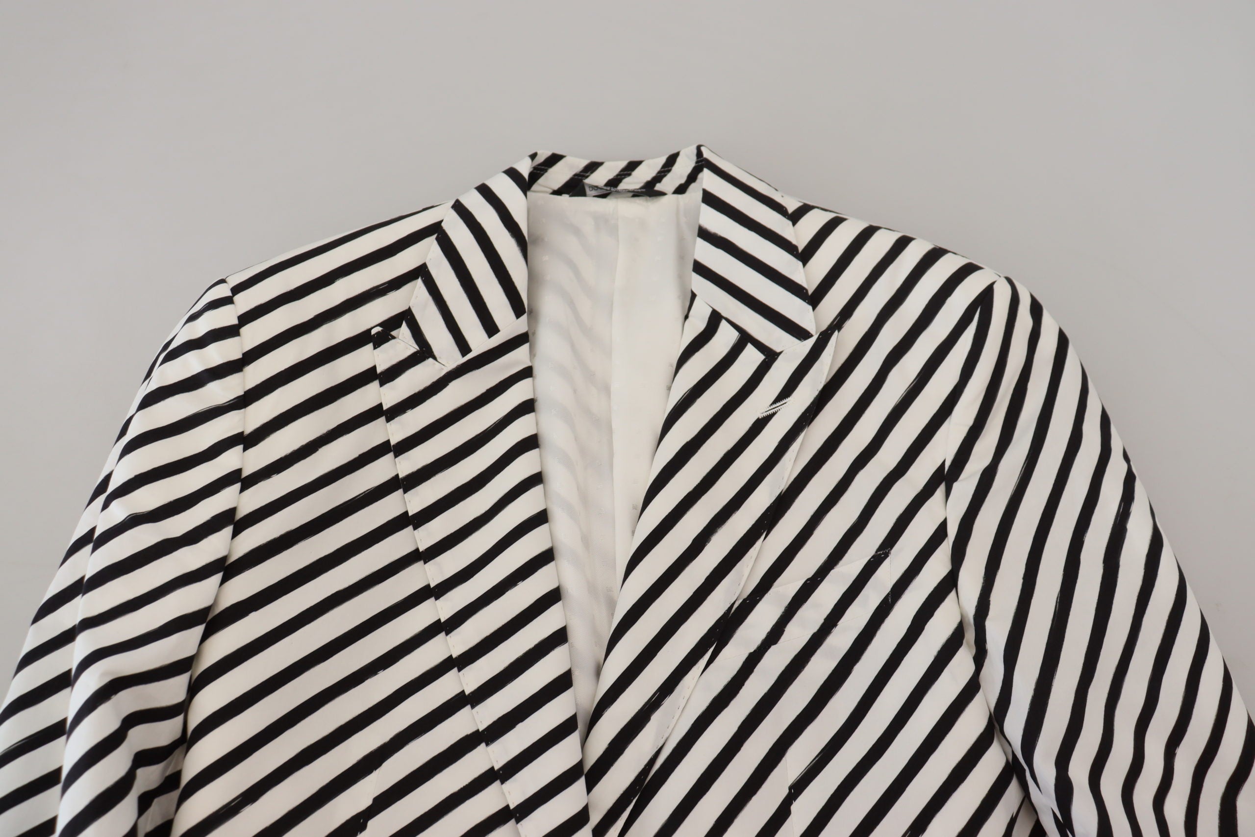 White and black striped slim fit blazer jacket from Dolce & Gabbana, featuring tailored design and classic lapel collar.