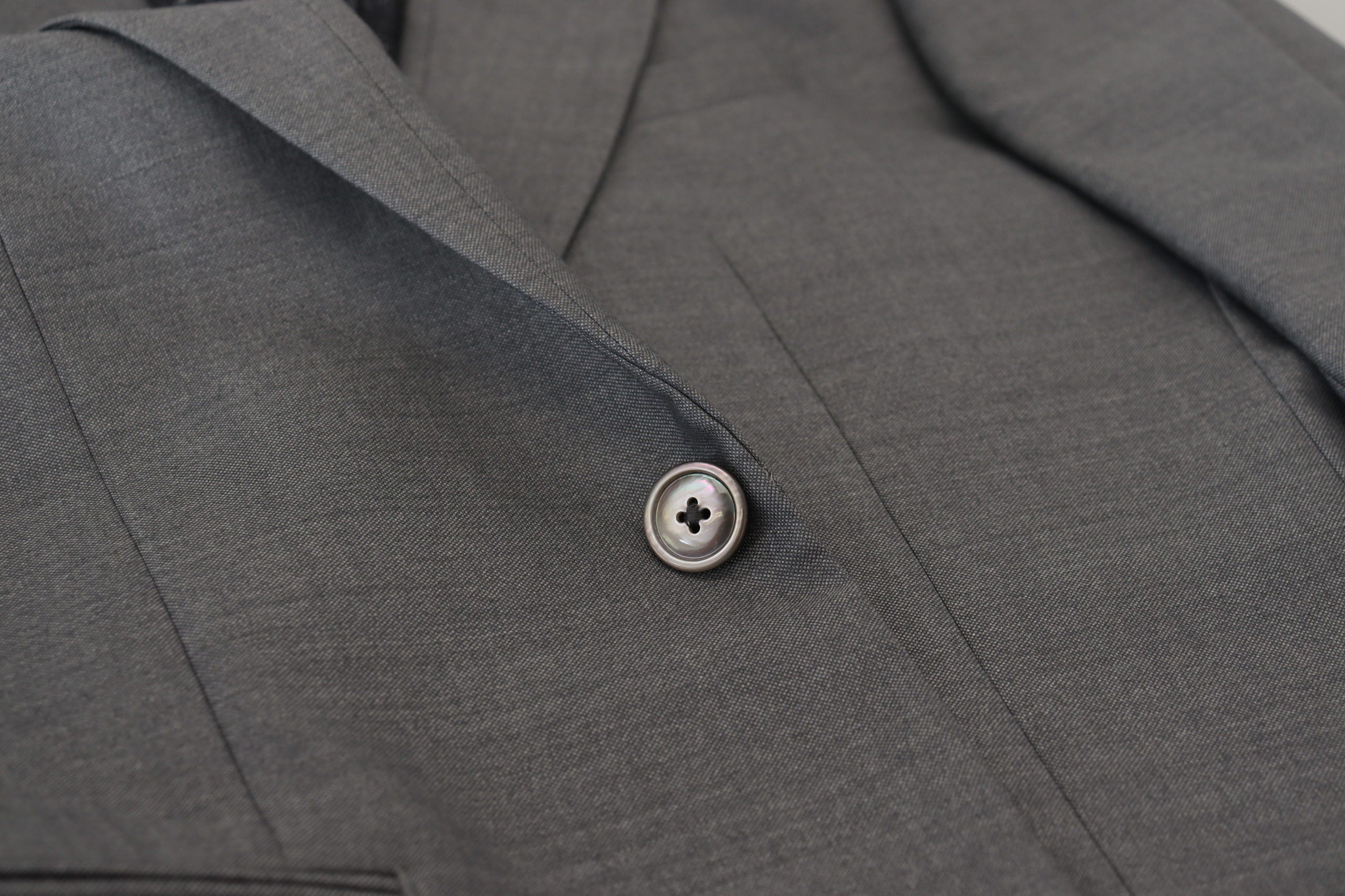 Gray wool silk slim fit blazer jacket by Dolce & Gabbana, tailored fit with elegant lapels and structured design.