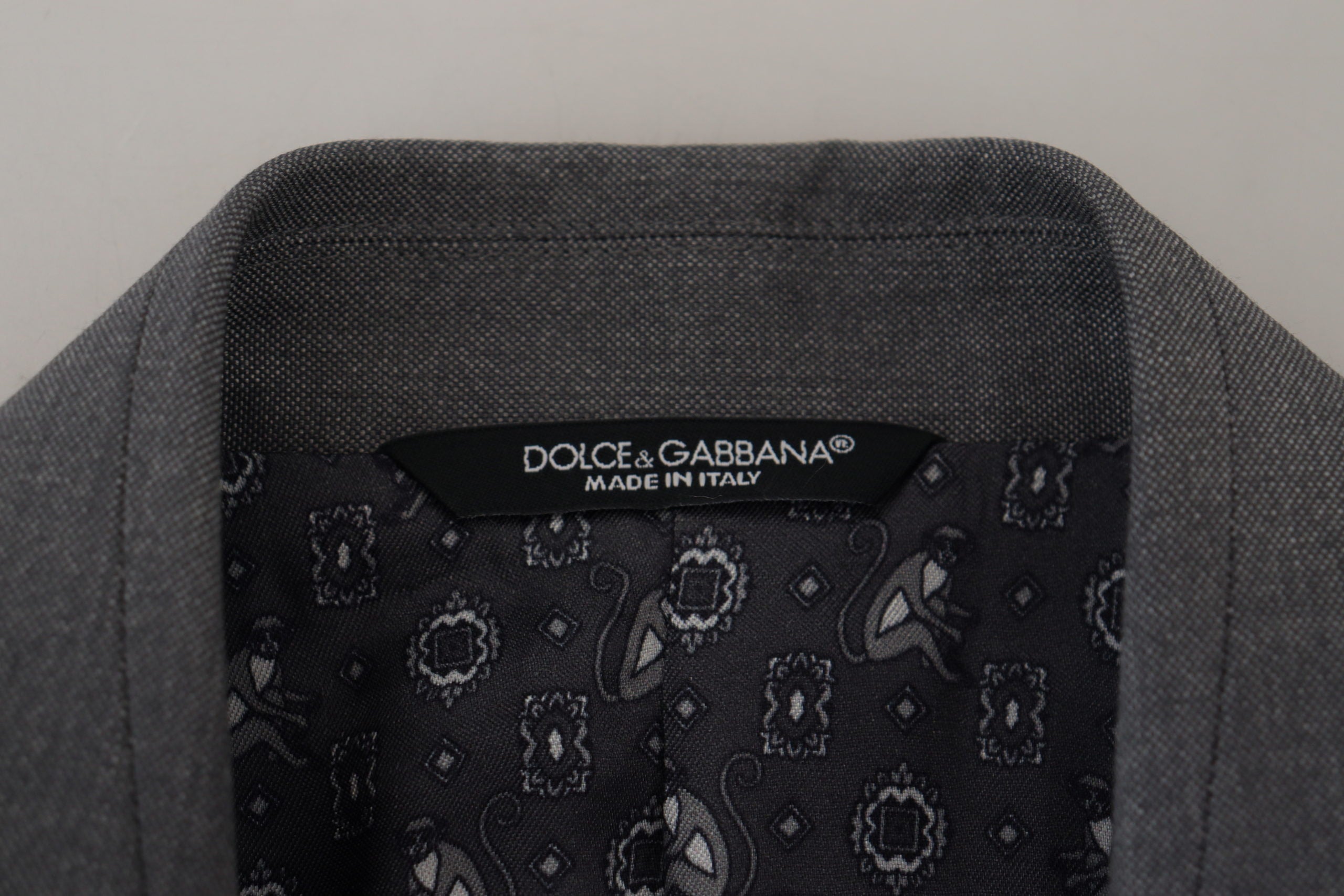 Gray wool silk slim fit jacket blazer by Dolce & Gabbana, showing tailored design and elegant lapel details.