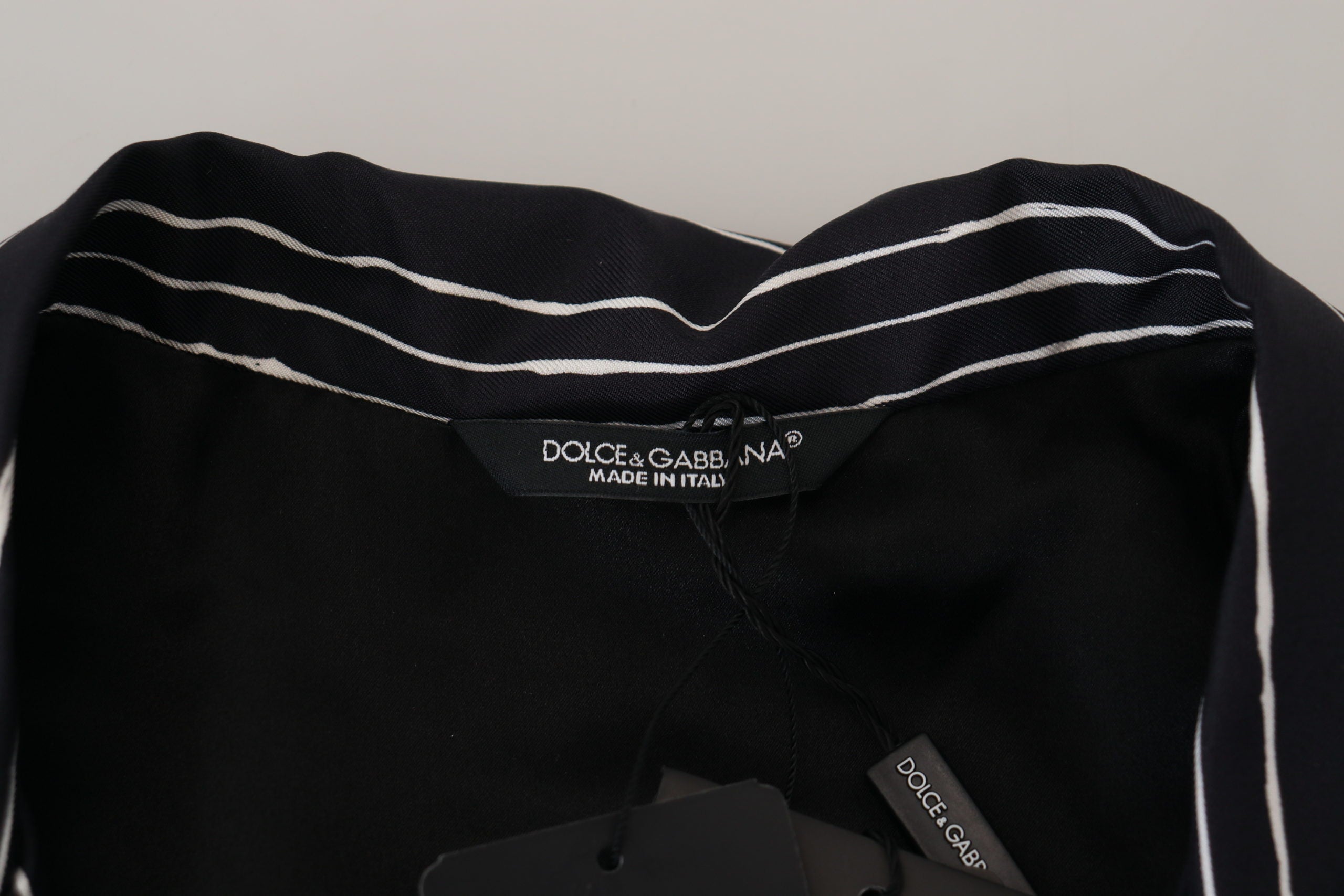 Blue striped silk pajama shirt jacket by Dolce & Gabbana, featuring a relaxed fit, button front, and classic collar.