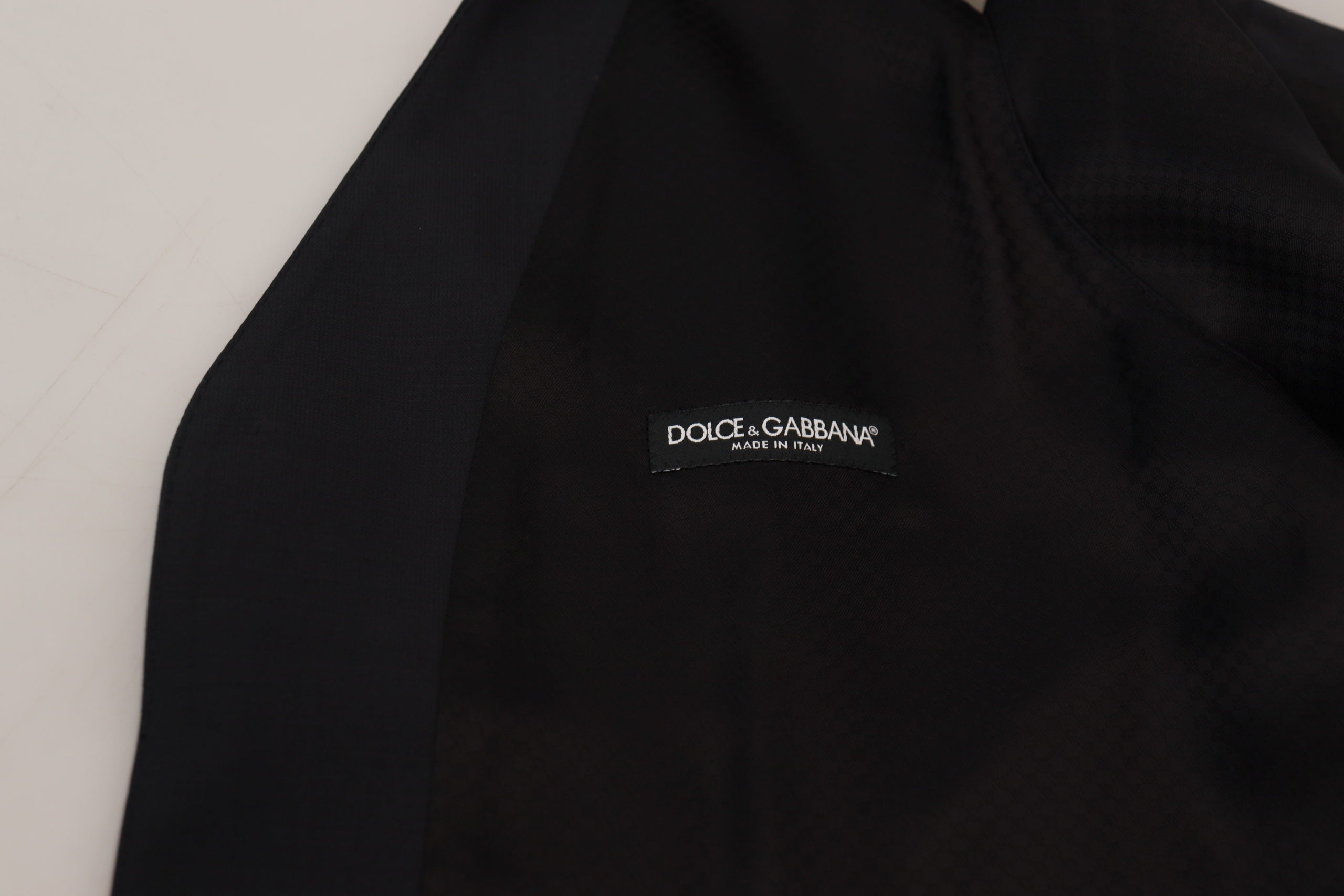 Black wool stretch waistcoat by Dolce & Gabbana, formal vest with tailored fit and classic design, shown on a plain background.