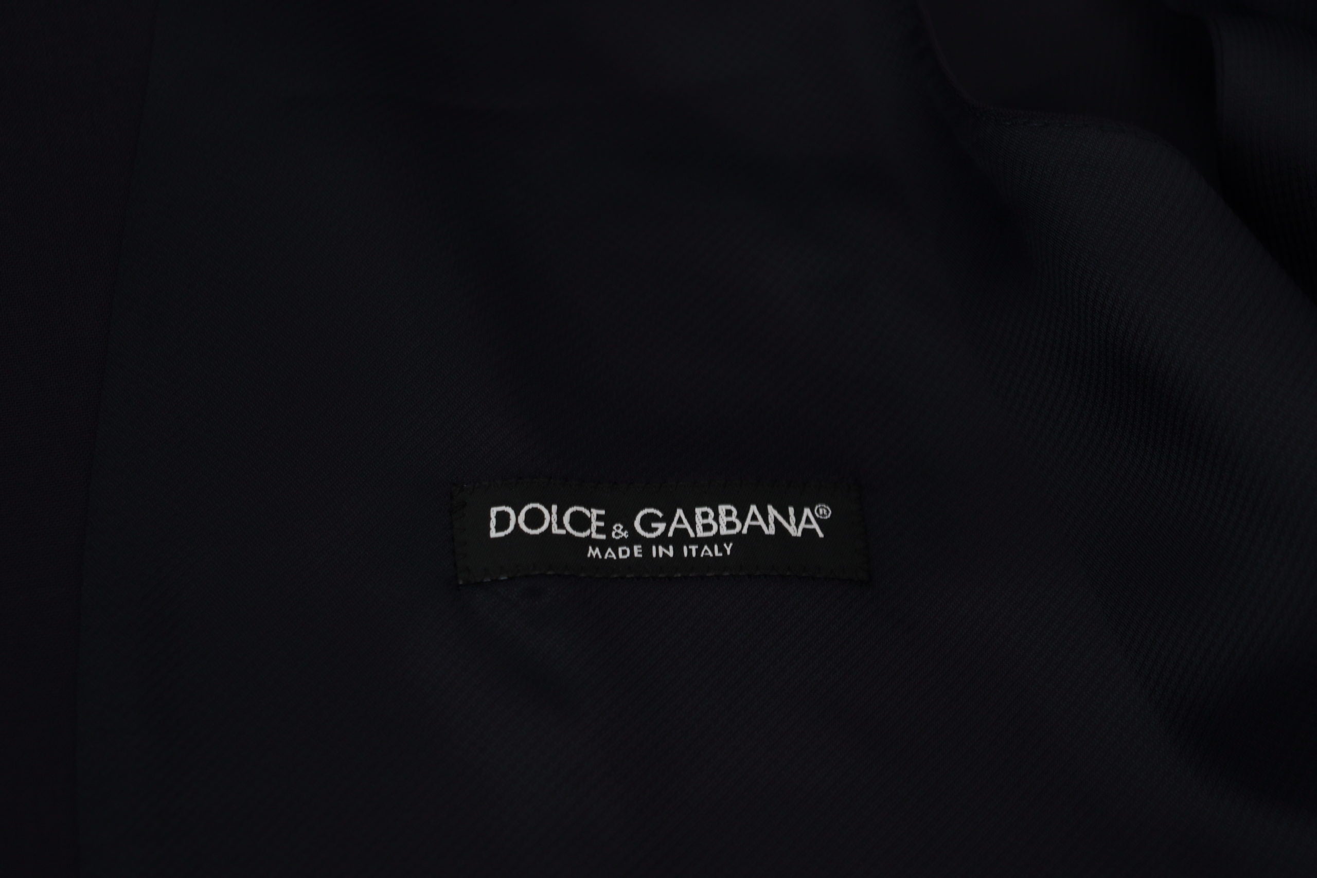 Dark blue wool stretch waistcoat by Dolce & Gabbana, formal vest with tailored fit and classic design, front view.