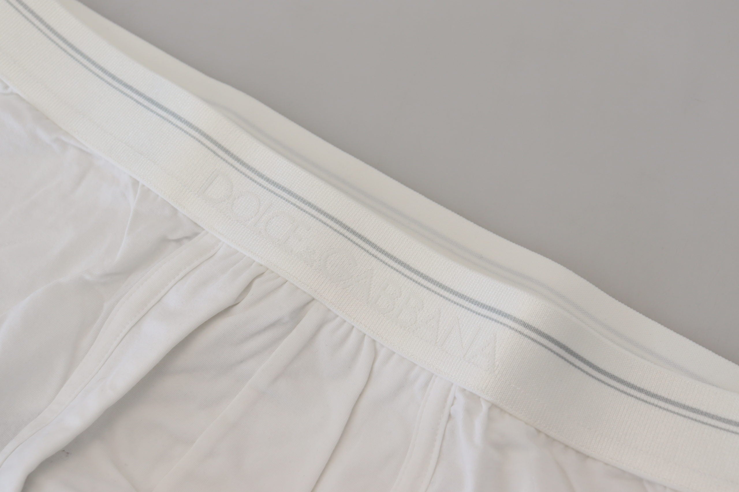 White cotton blend regular boxer underwear by Dolce & Gabbana, shown laid flat with waistband and leg openings visible.