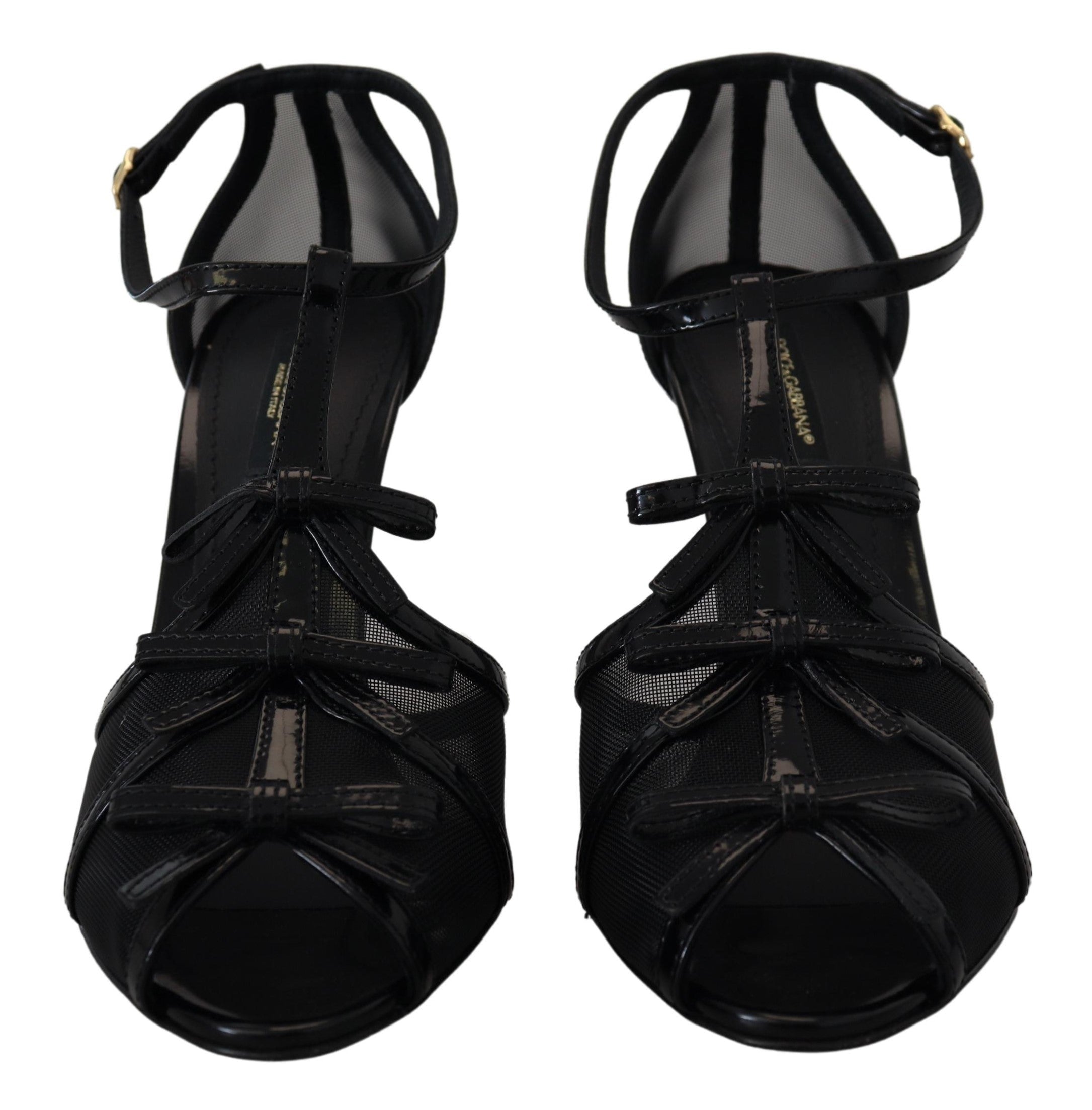 Black stiletto high heel sandals by Dolce & Gabbana with sleek straps and pointed toe, stylish footwear for formal occasions.