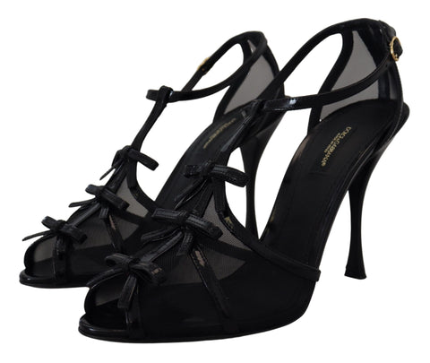Black Dolce & Gabbana stiletto high heel sandals with ankle straps and sleek design.