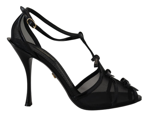Black Dolce & Gabbana stiletto high heel sandals with ankle straps and open toe design.