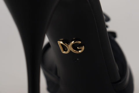 Black Dolce & Gabbana stiletto high heel sandals with thin straps and pointed toes, stylish footwear for elegant occasions.
