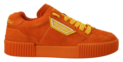 Orange leather P.J. Tucker sneakers by Dolce & Gabbana, showcasing stylish design and vibrant color on a sleek athletic shoe.