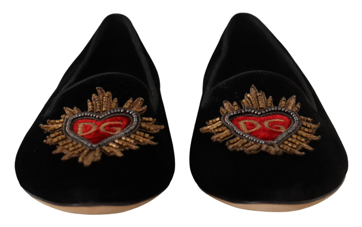 Black Dolce & Gabbana Sacred Heart patch slip-on flat shoes with logo details and comfortable design.