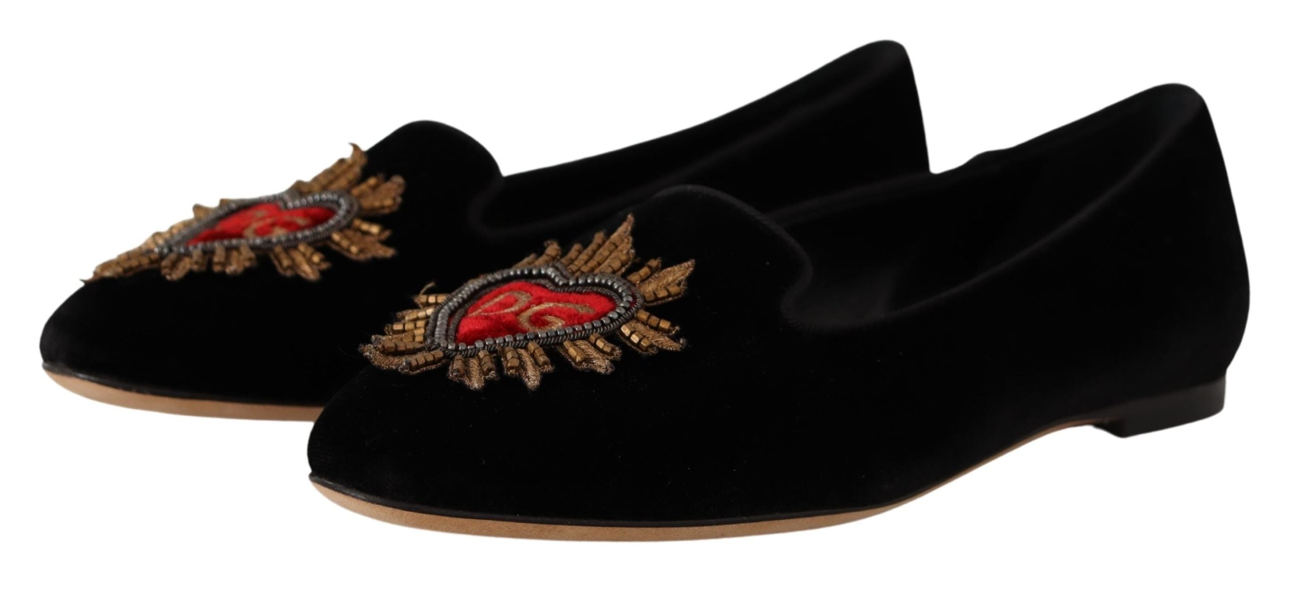 Black Dolce & Gabbana Sacred Heart Patch slip-on flat shoes with decorative heart patch detail and sleek design.