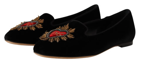 Black Dolce & Gabbana Sacred Heart Patch slip-on flat shoes with decorative heart patch detail and sleek design.