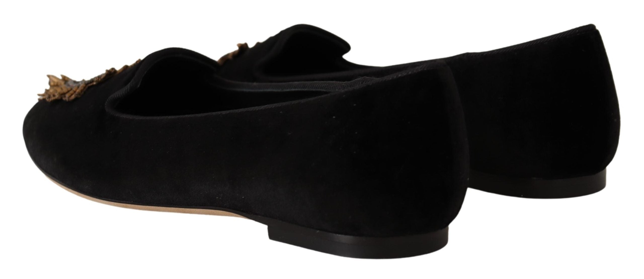 Black Dolce & Gabbana Sacred Heart patch slip-on flat shoes with decorative heart detail and sleek design.