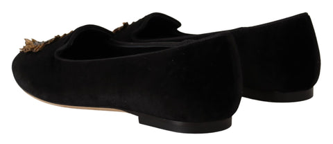 Black Dolce & Gabbana Sacred Heart patch slip-on flat shoes with decorative heart detail and sleek design.