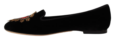 Black Dolce & Gabbana Sacred Heart patch slip-on flat shoes with rounded toe and logo detail on the upper.