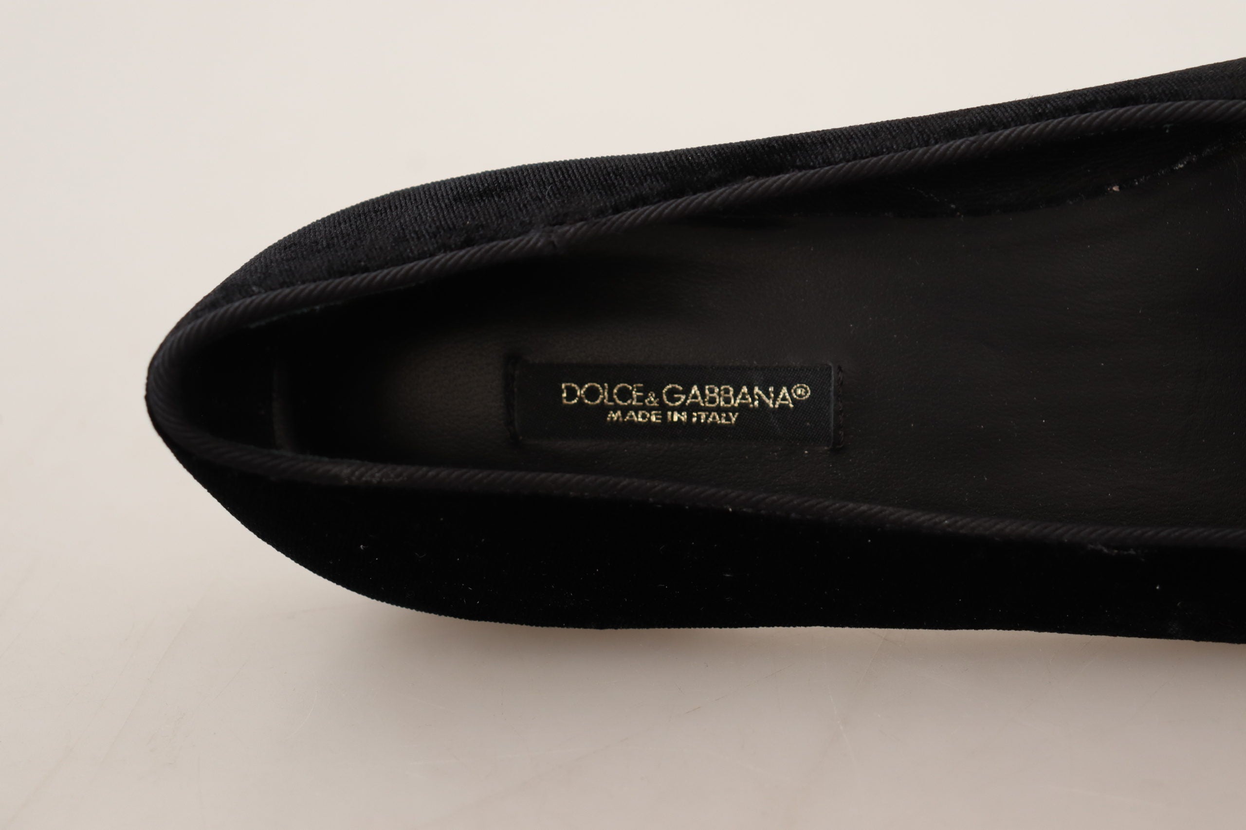 Black Dolce & Gabbana Sacred Heart patch slip-on flat shoes with logo detailing and comfortable flat sole.