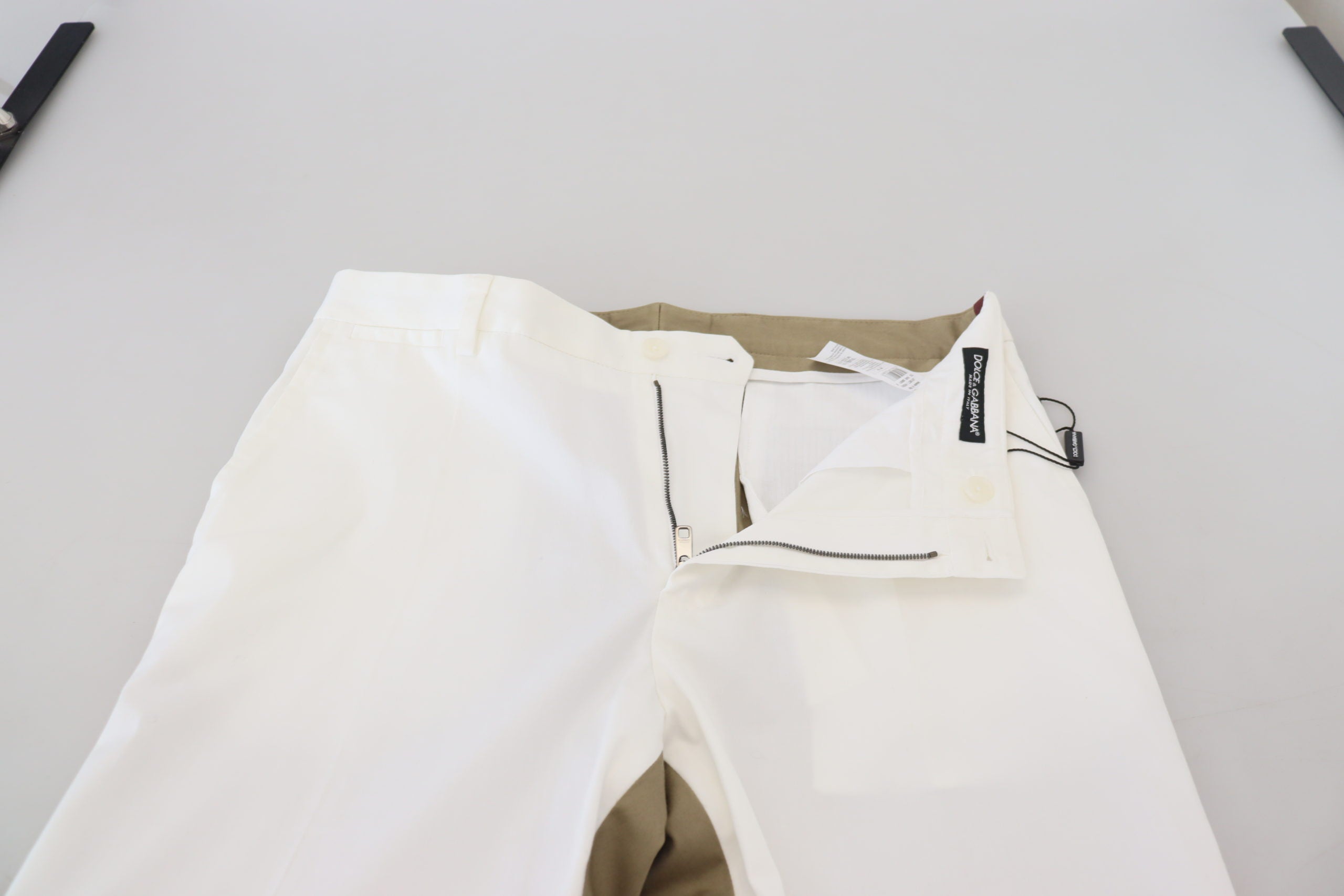 White and brown slim fit chino pants by Dolce & Gabbana, showing a tailored design and classic fit.