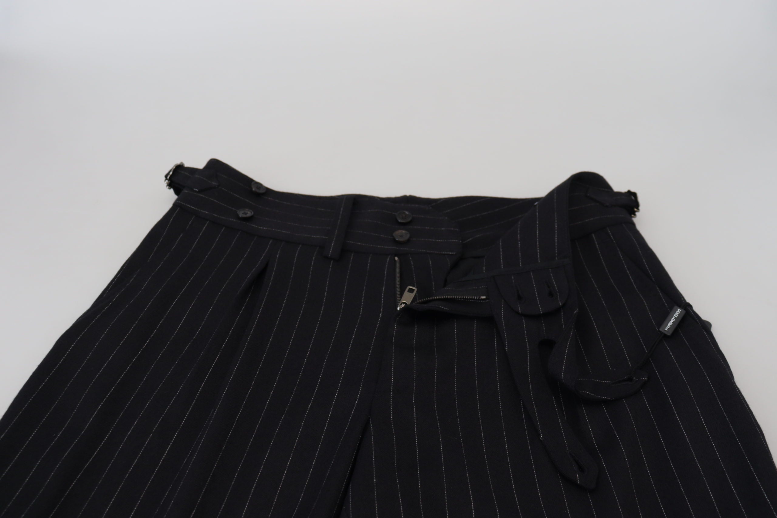 Black wool striped chino pants by Dolce & Gabbana, tailored fit with classic design and belt loops, shown on a model.